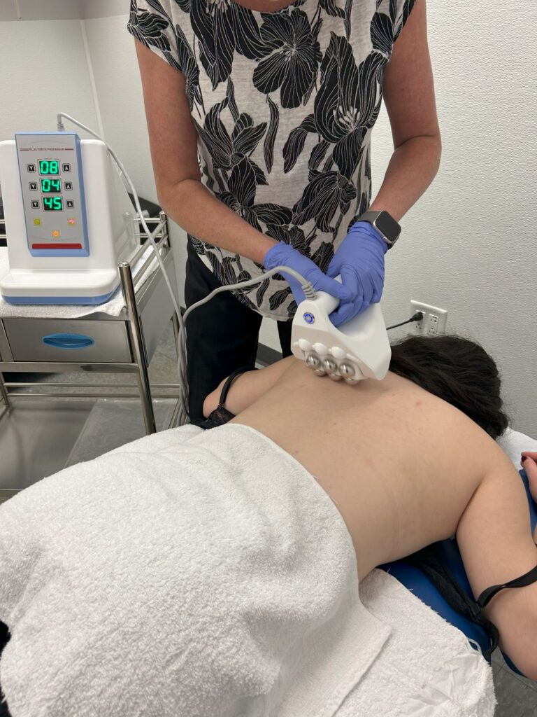 lymphatic drainage device placed on a woman's back